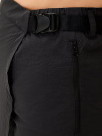 a person wearing a black skirt