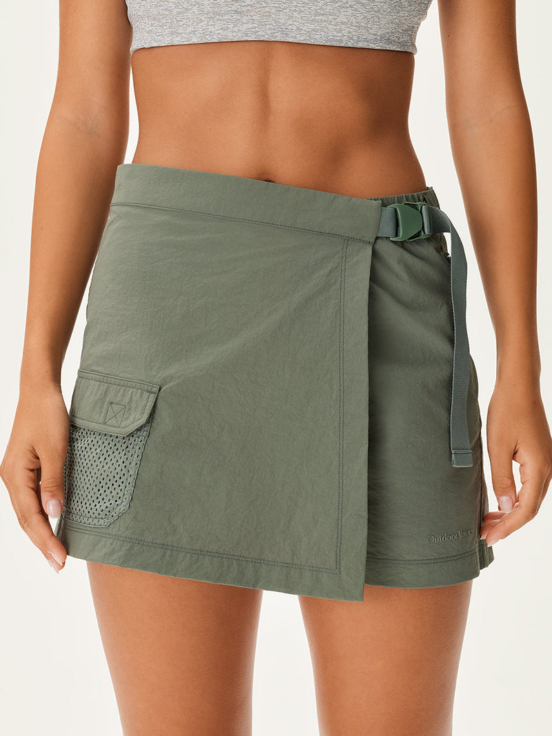 a person wearing a green skirt