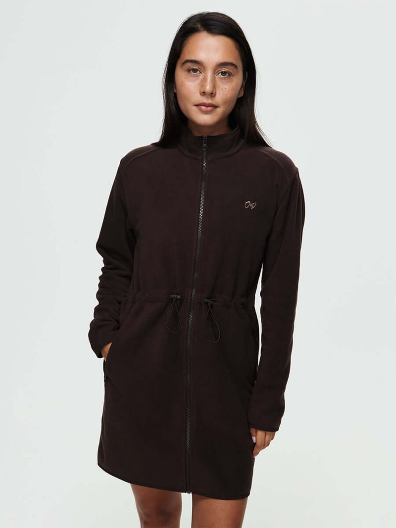Model wearing Boulder Dress in Dark Brown with full zip and adjustable waist toggles, styled for everyday wear.