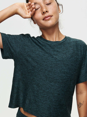 Model wearing the CloudKnit Boxy Shortsleeve shirt, with comfort and style in breathable fabric.