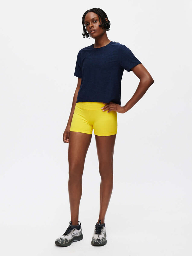 Model posing in CloudKnit Boxy Shortsleeve in Navy, featuring a relaxed fit and cropped length.