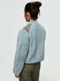 Back view of Candy Fleece Jacket in Light Blue with contrast technical nylon panels on the shoulders.