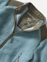 Flat lay of Candy Fleece Jacket in Blue, with the soft fleece texture and contrasting technical nylon panels.