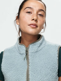 Model wearing Candy Fleece Vest in Light Blue with a zip-up mock neck and soft texture.