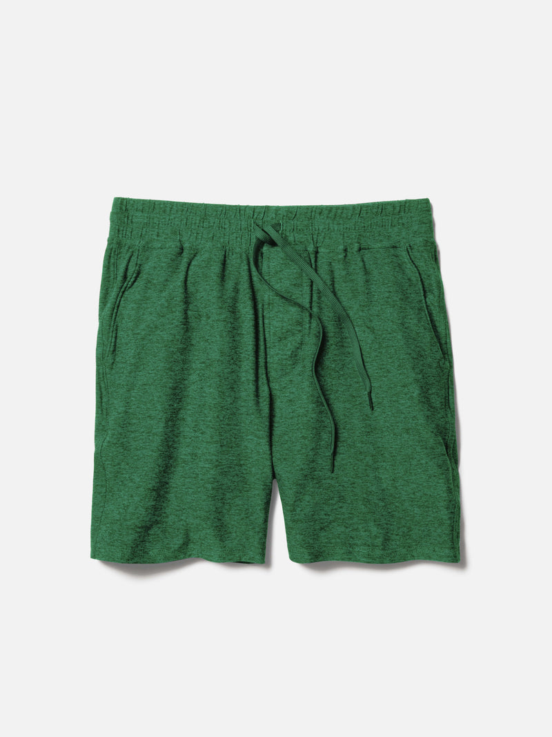Flat lay of CloudKnit 7" Short in Green, featuring a comfort fit adjustable waistband and side pockets.