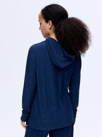 Back view of model wearing CloudKnit Hoodie in Navy, with the lightweight design and hood.