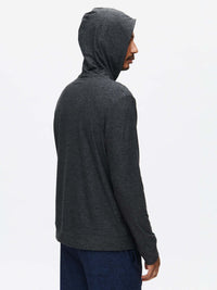 Side view of model wearing CloudKnit Hoodie in Charcoal, with the lightweight fabric and relaxed fit.