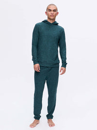 Model standing in CloudKnit Hoodie in Dark Teal, featuring a lightweight and breathable fabric.