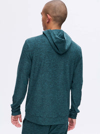 Back view of model wearing CloudKnit Hoodie in Teal with a soft, breathable fabric, for everyday wear.