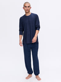 Model standing in CloudKnit Longsleeve and matching pants in Navy, featuring a soft and relaxed fit.