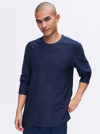 Model posing in CloudKnit Longsleeve in Navy, with its lightweight and soft fabric.