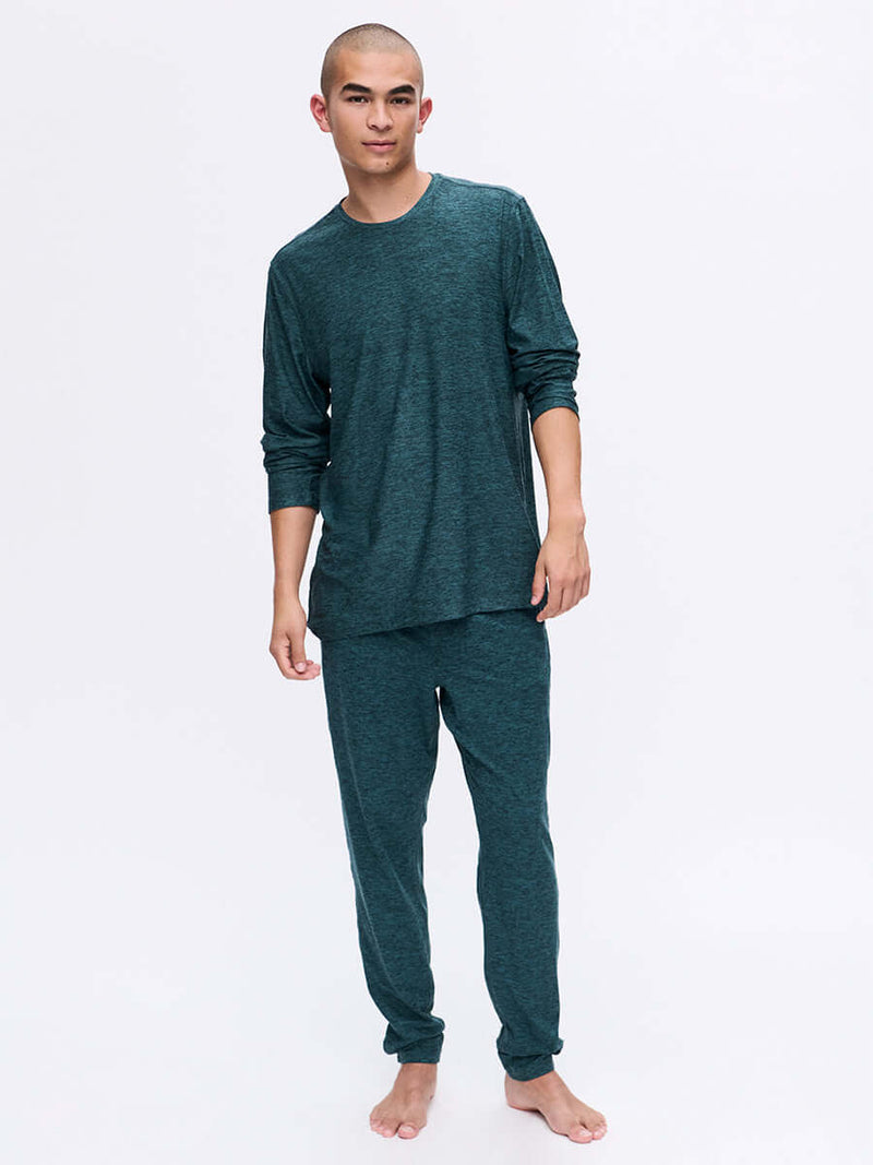 Model wearing CloudKnit Longsleeve in Dark Teal with relaxed fit, styled for lounging.