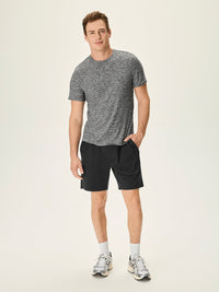 Model wearing CloudKnit Shortsleeve in Gray, super soft and breathable fabric, for everyday activities.