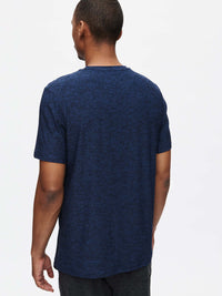 Back view of model wearing CloudKnit Shortsleeve in Navy, soft and lightweight fabric for everyday wear.