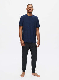 Model standing in CloudKnit Shortsleeve in Navy, super soft fabric for everyday comfort.