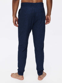 Back view of CloudKnit Slim Sweatpant in Navy, featuring a comfortable drawstring waistband and pockets.