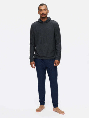 Model standing in CloudKnit Slim Sweatpant in Navy, soft and breathable fabric for everyday comfort.