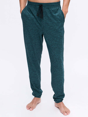 Model wearing CloudKnit Slim Sweatpant in Dark Teal, with the custom-fit drawstring waistband and pockets.