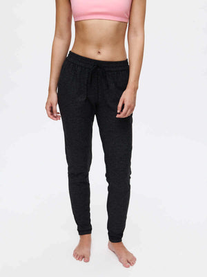 Model standing in CloudKnit Sweatpant in Black, featuring a drawstring waistband and side pockets.