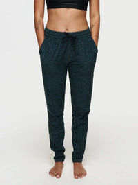 Model wearing CloudKnit Sweatpant featuring side pockets and a drawstring waistband, for comfort and style.