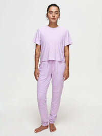 Model wearing CloudKnit Sweatpant with matching top in lavender, with comfort and style.