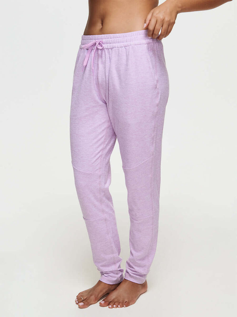 Woman wearing CloudKnit Sweatpant in light pink, with a custom-fit drawstring waistband.