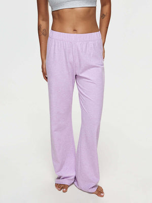 Model wearing CloudKnit Wide Leg Pant in lavender, with the soft, breathable fabric and relaxed fit.