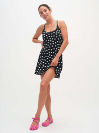 Model posing in Club Dress with polka dots, featuring adjustable straps and a playful hem.