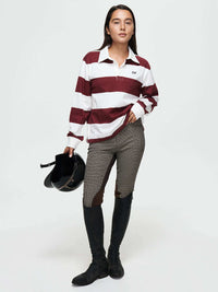 Stylish model wearing a Club Polo with ribbed cuffs, for fall layering in elegant equestrian apparel.