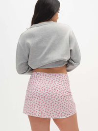 Back view of Club Skort in floral print, featuring a cute bow and built-in shorts for ease of movement.