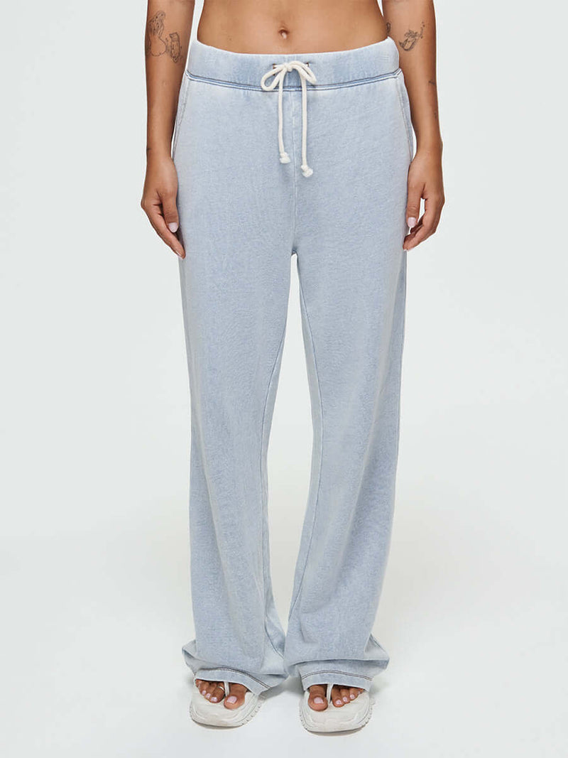 Model wearing Desert Pant in light blue, featuring an elastic waistband and wide-leg design.