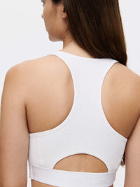 Back view of Doing Things Bra in White, featuring a mesh backing and removable bra pads.
