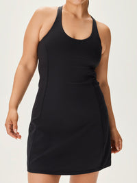 Model wearing Doing Things Dress in Black with supportive racerback design, for active lifestyles.