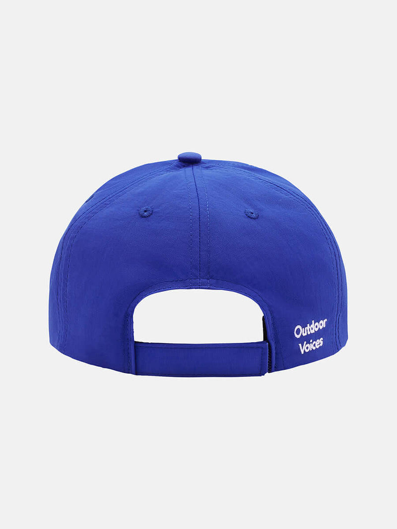 Back view of Doing Things Hat in blue, featuring adjustable strap and Outdoor Voices logo.