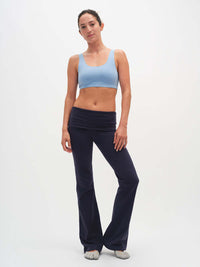 Model wearing Double Dip Bra in Cotton Candy with double scoop neckline and wide shoulder straps, styled for everyday wear.