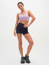 Model wearing Double Dip Bra in Cotton Candy with wide shoulder straps, styled with matching shorts.