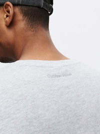 Close-up of Everyday Classic Shortsleeve in Grey, featuring a soft neckline and Outdoor Voices logo on the back.