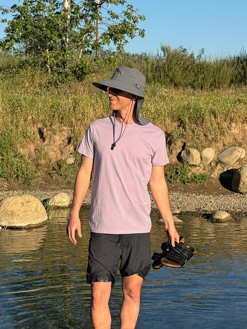 Model standing in water wearing Everyday Classic Shortsleeve in Lavender, soft organic cotton jersey for low-sweat activities.