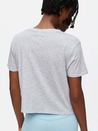 Back view of Everyday Shortsleeve in Grey, featuring a relaxed fit and slightly cropped length.