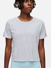 Model facing forward in Everyday Shortsleeve, cropped style made from comfortable, garment-dyed organic cotton.