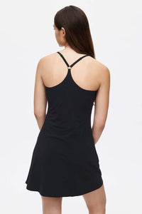 Back view of The Exercise Dress in Black, featuring adjustable straps and a built-in shorts liner.