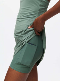 Side view of The Exercise Dress in Sage, showing built-in shorts liner with side pocket for convenience.