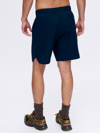 Back view of High Stride 7" Short with Pockets in Navy, showing the comfortable elastic waistband.