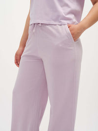 Close-up view of Malibu Sweatpant in Lilac, featuring side pockets and an elastic waistband with drawcord.
