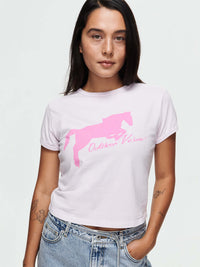Mustang Tee featuring a pink horse graphic on a lightweight Orchid Dust tee, for equestrian enthusiasts.
