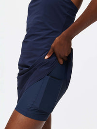Detail view of The Exercise Dress in Navy, showing side pocket and built-in shorts liner.