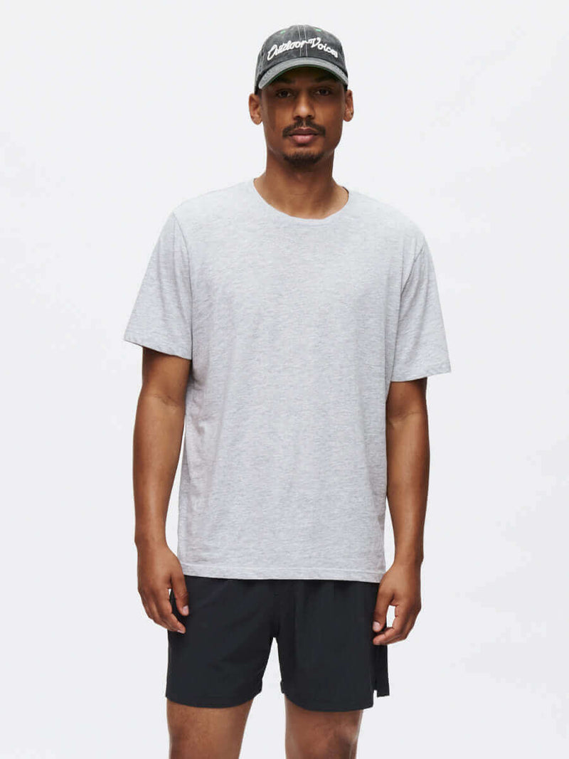 Model wearing Zephyr 5" Short in Black, with a custom-fit drawstring waist and lightweight performance fabric.