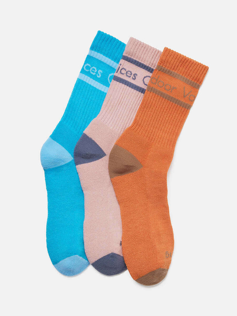 Flat lay of OV Club Crew Sock 3-Pack in blue, pink, and orange with 'Doing Things' printed for easy identification.