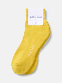 Flat lay of OV Rec Ankle Sock in yellow, featuring ribbed ankle and cushioned bottom for casual exercise.