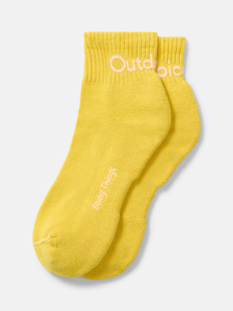 Flat lay of OV Rec Ankle Sock in Yellow, featuring a ribbed cuff and "Doing Things" text.